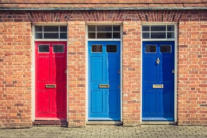 Three differently coloured front doors